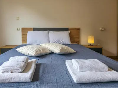 a bedroom with a bed with two towels on it at Cozy 1BD Flat in Pirin Sense by Flat Manager in Bansko