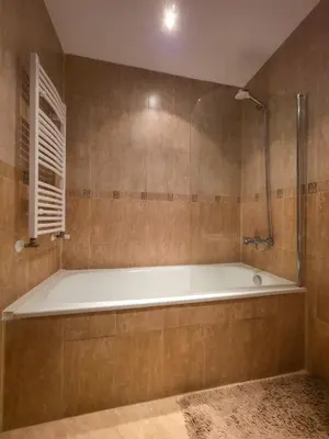 a large bathroom with a tub and a shower at Charming 1BD Flat at Edelweiss Inn, Bansko by Flat Mаnager in Bansko