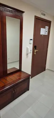 a room with a mirror and a wooden door at Gondola luxury apartment 2 in Bansko