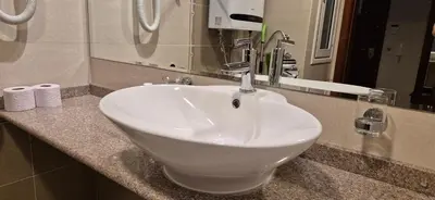 a white sink sitting on a counter in a bathroom at Gondola luxury apartment 2 in Bansko