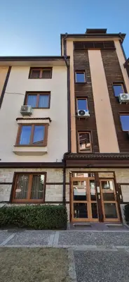 a tall building with many windows on the side of it at Gondola luxury apartment 1 in Bansko