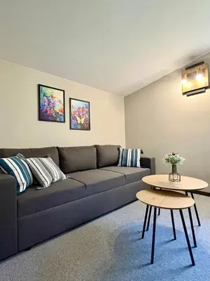a living room with a couch and a table at Villa Veranda in Smolyan