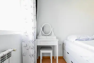 a white bedroom with a mirror and a bed at Stylish 1BD Apt in Lozenets with large balcony by Flat Manager in Sofia