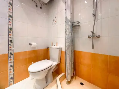 a bathroom with a toilet and a shower at Stylish 1BD Apt in Lozenets with large balcony by Flat Manager in Sofia