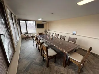 a conference room with a long table and chairs at Villa Geshevi in Hisarya