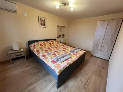 a bedroom with a bed with two pillows on it at Villa Geshevi in Hisarya