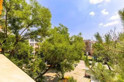 a view of a park with trees and buildings at Spacious 2BR Apt Kremena 10 minutes walk to Center in Plovdiv