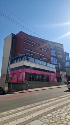 a large building with a person standing in front of it at Boho Style in Samokov
