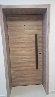a wooden door with a handle in a room at Boho Style in Samokov