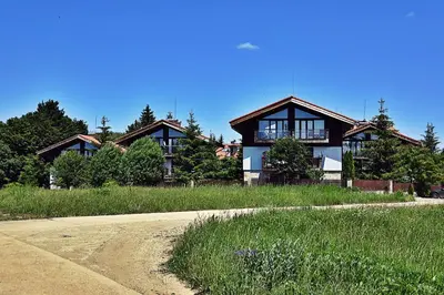 a house sitting on the side of a road at Hrebet House in Borovets