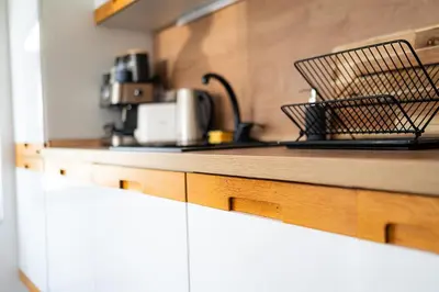 a kitchen with a counter top with at Mall of Sofia - UrbanLux Ampla 2BDR FREE Parking in Sofia