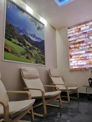 a waiting room with four chairs and a painting on the wall at Complex Koko Hills in Sapareva Banya