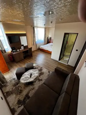 a living room with a couch and a bed at Complex Koko Hills in Sapareva Banya