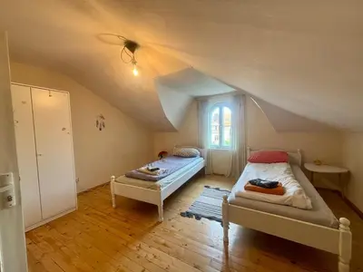 two beds in a room with an attic at Quiet and Lovely 2 BDRM loft in the Old Centre in Sofia