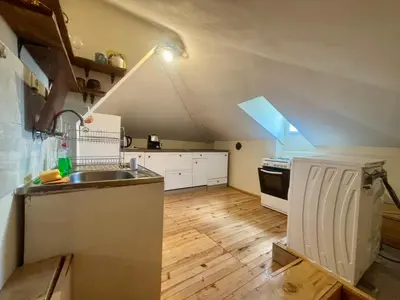 an attic kitchen with a sink and a stove at Quiet and Lovely 2 BDRM loft in the Old Centre in Sofia