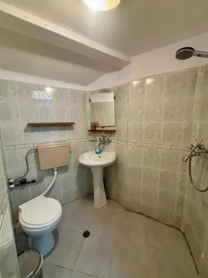 a bathroom with a toilet and a sink at Quiet and Lovely 2 BDRM loft in the Old Centre in Sofia