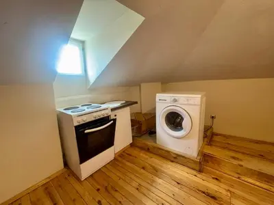 a kitchen with a stove and a washing machine at Quiet and Lovely 2 BDRM loft in the Old Centre in Sofia