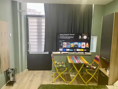 a room with a large screen on the wall at GuestHouse Karma369 in Plovdiv