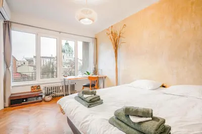 a bedroom with a bed with towels on it at TERRA Design - Award-Winning Apartment - by Flat Manager in Sofia