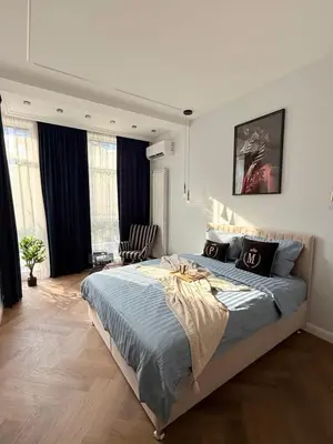 a bedroom with a large bed in a room at The Giraffe's apartment in Sofia