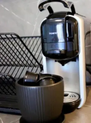 a coffee maker sitting on a counter with a bowl at Candy 26 Apartment in Velingrad
