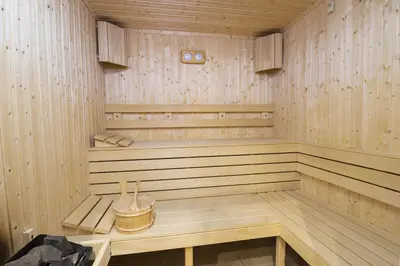 a wooden sauna with a bench in it at Апартамент Борчето Forest Glade- Pamporovo in Pamporovo