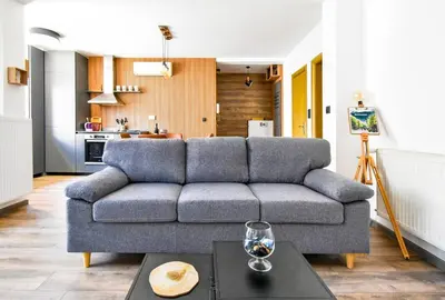 a living room with a couch and a table at 2 Apartments, 2 Parking - Sleeps 8 - Quiet Central in Sofia