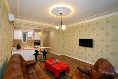 a living room with leather couches and a red table at Apartment in Sofia Centre by Flat Manager in Sofia