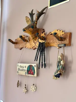 a wall with a wooden dragon decoration on a wall at Chalet Hamars - Highland Haven in Razlog