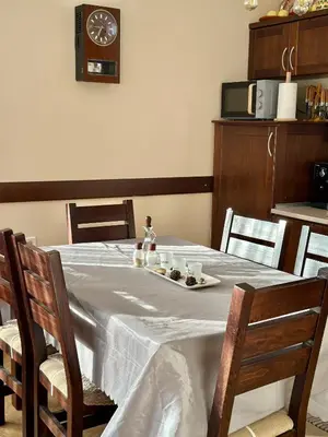 a table with a plate of food on top of it at Chalet Hamars - Highland Haven in Razlog
