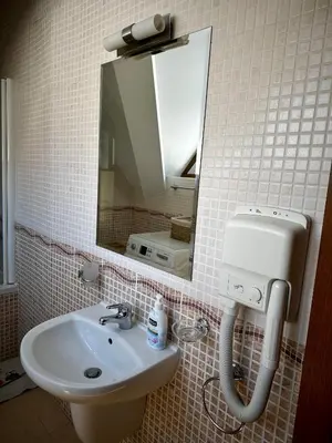 a bathroom with a sink and a mirror at Chalet Hamars - Highland Haven in Razlog