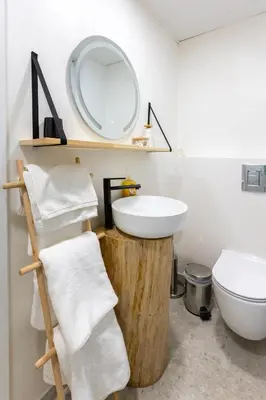 a bathroom with a sink and a mirror at Mont Blanc Apartment in Bansko