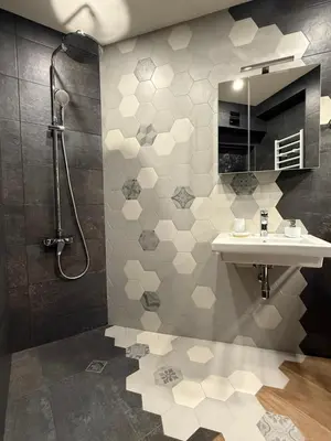 a bathroom with a sink and a shower at Gorna Banya luxury apartments in Sofia