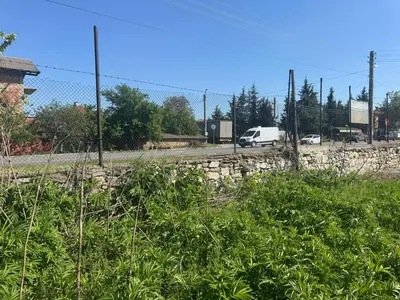 a fence with a van driving down a road at Pazardzhik Shelter House 3 Empty Rooms, No Electric, No Water, No WC, Free Car Parking, Glavinitsa Self Check-in