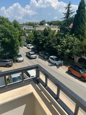 a view of a parking lot with cars parked at Cozy apartment, by Paradise Mall in Sofia