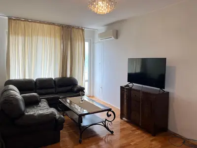 a living room with a couch and a tv at South Park in Sofia