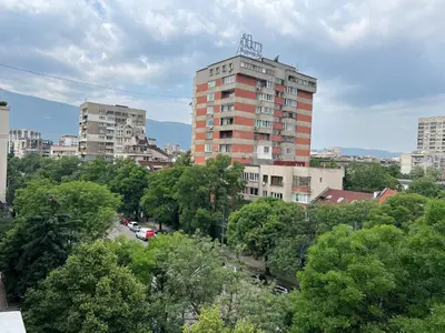 a tall building in the middle of a city at South Park in Sofia