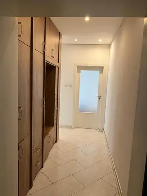 a room with a hallway with a television and a door at South Park in Sofia