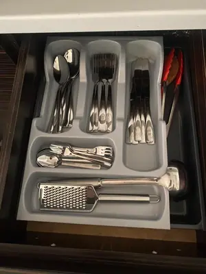 a tray filled with utensils in a drawer at Pirin 7 in Pazardzhik