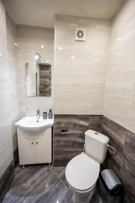 a bathroom with a toilet and a sink at Spacious 1BDR in the Center with FREE Parking in Sofia