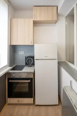 a kitchen with a white refrigerator and a stove at Spacious 1BDR in the Center with FREE Parking in Sofia