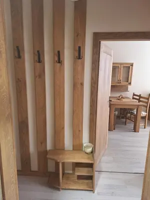 a room with a table and a bench and a mirror at Ego apartment Velingrad in Velingrad