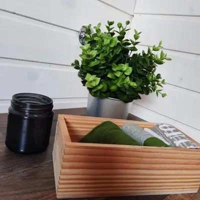 a wooden box sitting on a table with a plant at Bendji Land - vacation hideaway, close to Sofia in Ribarica