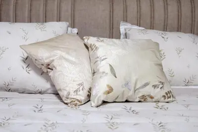 two pillows sitting on top of a bed at Heart & Honey - The Romantic Loft in Plovdiv
