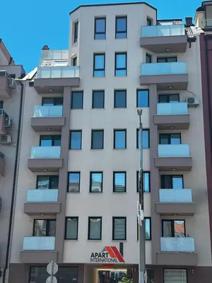 an apartment building with balconies on a city street at Heart & Honey - The Romantic Loft in Plovdiv
