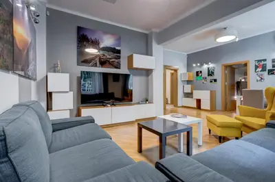 a living room with a couch and a table at San Stefano 4 Free Parking 2 BRDM 100m Zaimov Park in Sofia