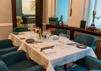 a table in a room with a white table cloth at Bright, City Centre, 1BR Apartment , Next to Sofia University in Sofia
