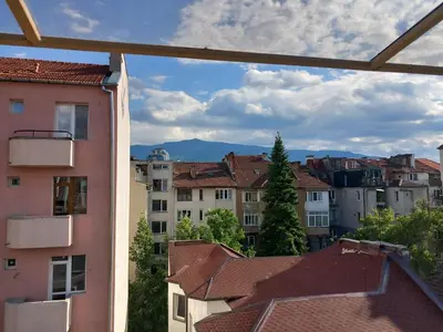 a view of a city from the window of a building at the green apart in Sofia