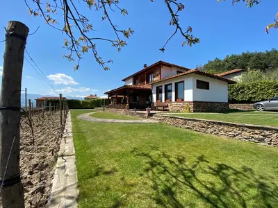 a house with a fence in front of it at Къщата на тати in Garmen