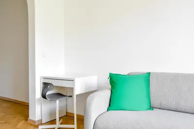a living room with a couch and a table at Scandinavian Charm - Central 1BD with Desk by Flat Manager in Sofia